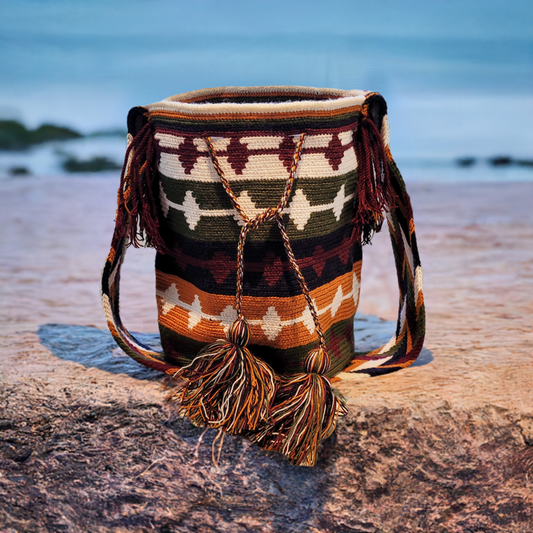 "Colorful handmade Wayuu crochet bag with geometric patterns, adjustable strap, perfect for daily use or beach outings."