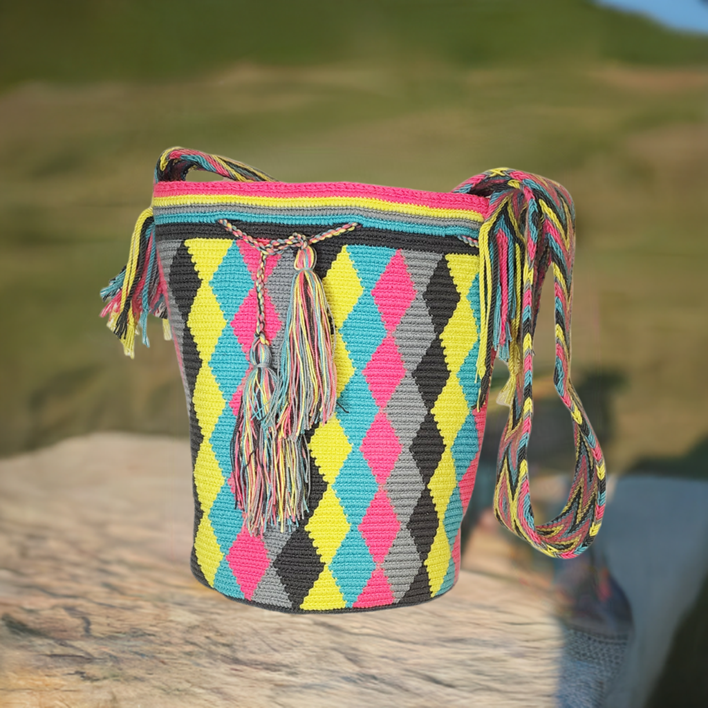 "Colorful handmade Wayuu crochet bag with geometric patterns, ideal as a boho crossbody or shoulder bag."