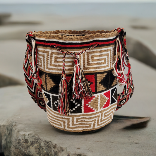 "Colorful handmade Wayuu crochet bag with geometric patterns, versatile shoulder or crossbody straps."