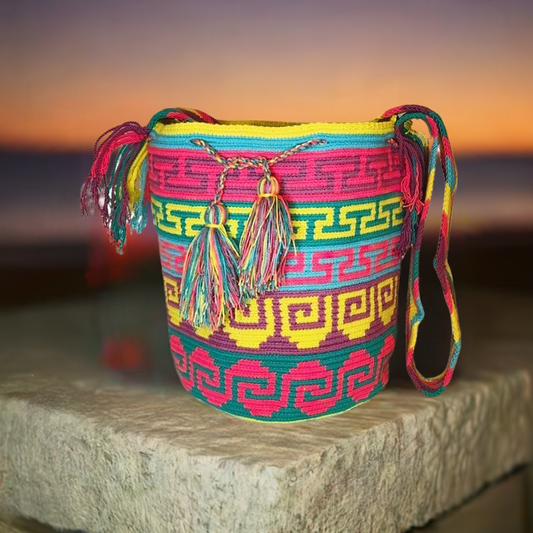 "Colorful handmade Wayuu crochet bag with geometric patterns, crafted by the Wuitusu community."