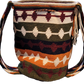 "Colorful handmade Wayuu crochet bag with geometric patterns, adjustable strap, perfect for daily use or beach outings."