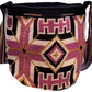 "Colorful handmade Wayuu crochet bag with geometric patterns and long, artisan-crafted straps for versatile wear."