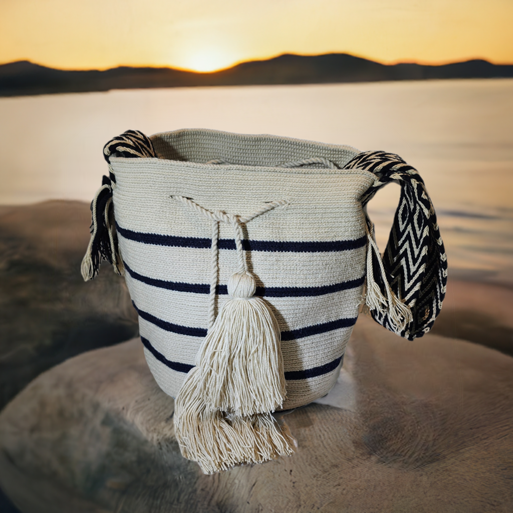 "Colorful handmade Wayuu crochet bag with intricate geometric patterns, showcasing traditional craftsmanship and ethical fash