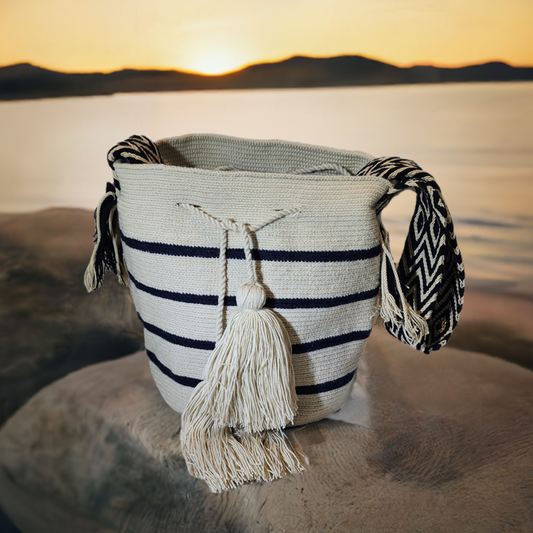 "Colorful handmade Wayuu crochet bag with intricate geometric patterns, showcasing traditional craftsmanship and ethical fash