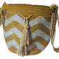 "Colorful handmade Wayuu crochet bag with intricate patterns and a long strap, showcasing traditional craftsmanship."