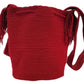 "Colorful handmade Wayuu crochet bag with vibrant bohemian designs, showcasing artisan craftsmanship and ethical fashion."