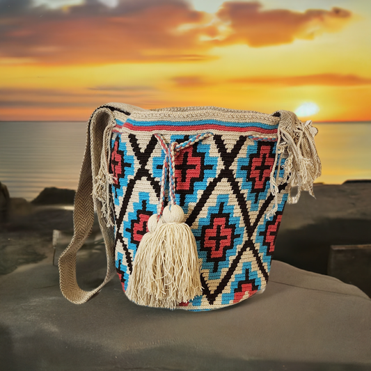 "Colorful handmade Wayuu crochet bag with vibrant geometric patterns, celebrating Colombian and Venezuelan heritage."