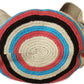 "Colorful handmade Wayuu crochet bag with vibrant geometric patterns, celebrating Colombian and Venezuelan heritage."