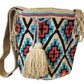 "Colorful handmade Wayuu crochet bag with vibrant geometric patterns, celebrating Colombian and Venezuelan heritage."