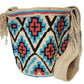 "Colorful handmade Wayuu crochet bag with vibrant geometric patterns, celebrating Colombian and Venezuelan heritage."