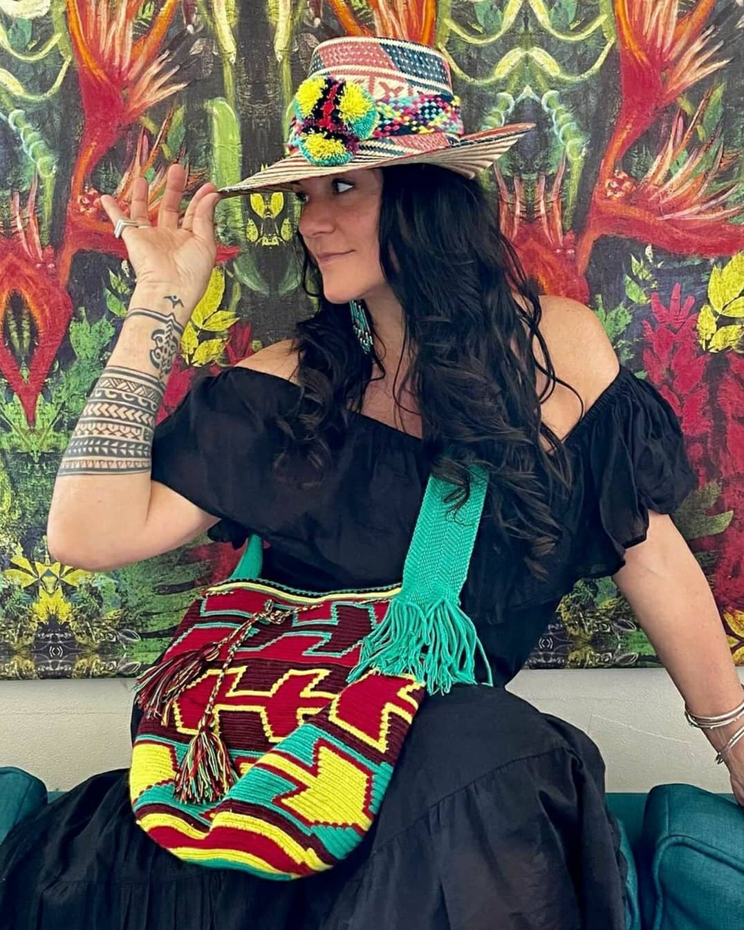 "Colorful handmade Wayuu crochet crossbody bag, showcasing traditional vibrant patterns and a boho flair, perfect for versati