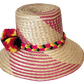 "Colorful Handmade Wayuu Hat by Wuitusu artisans, crafted from Iraca palm fibers, featuring adjustable styling and cultural p