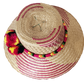 "Colorful Handmade Wayuu Hat by Wuitusu artisans, crafted from Iraca palm fibers, featuring adjustable styling and cultural p