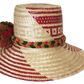 "Colorful Handmade Wayuu Hat by Wuitusu, crafted from Iraca palm fibers, featuring adjustable fit and decorative pompoms."