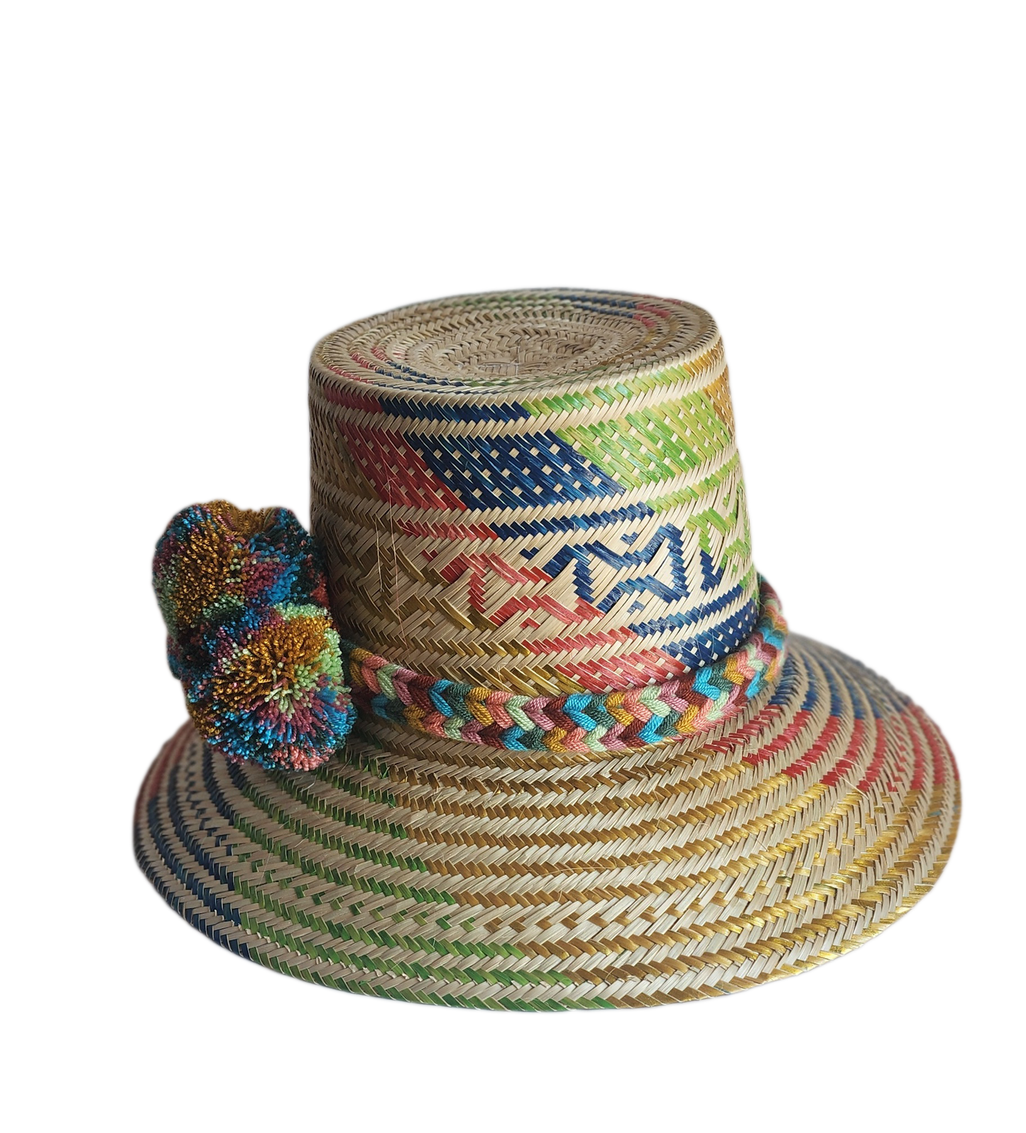 "Colorful handmade Wayuu hat by Wuitusu, crafted from Iraca palm fibers, adorned with culturally significant pompoms."