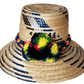 "Colorful handmade Wayuu hat crafted from Iraca palm, adorned with cultural pompoms for style and symbolism."