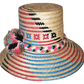 "Colorful handmade Wayuu hat crafted from Iraca palm, adorned with cultural pompoms, adjustable for a perfect fit."