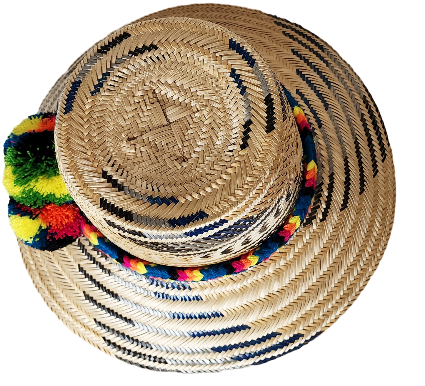 "Colorful handmade Wayuu hat crafted from Iraca palm, adorned with cultural pompoms for style and symbolism."
