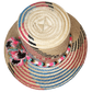 "Colorful handmade Wayuu hat crafted from Iraca palm, adorned with cultural pompoms, adjustable for a perfect fit."