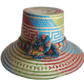 "Colorful handmade Wayuu hat crafted from Iraca palm, featuring adjustable size and cultural pompoms, supporting Wayuu artisa