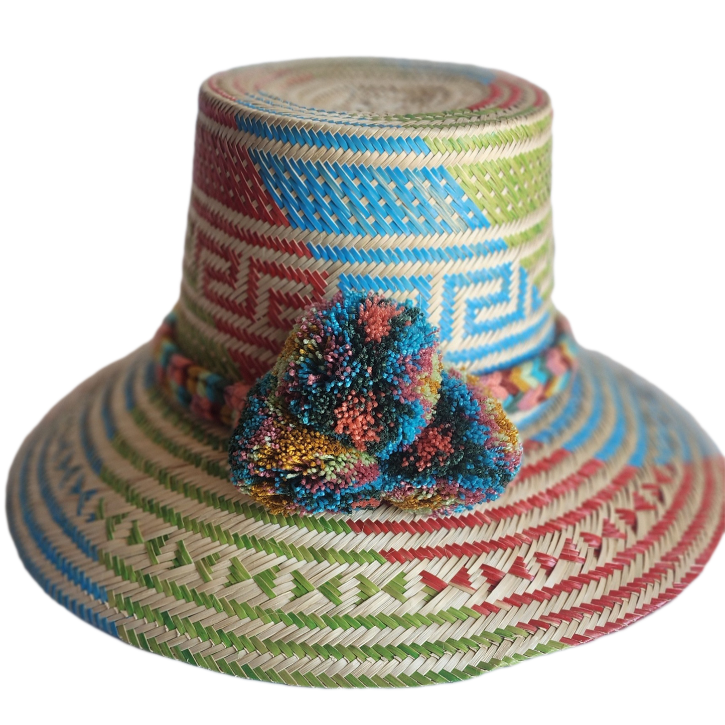 "Colorful handmade Wayuu hat crafted from Iraca palm, featuring adjustable size and cultural pompoms, supporting Wayuu artisa
