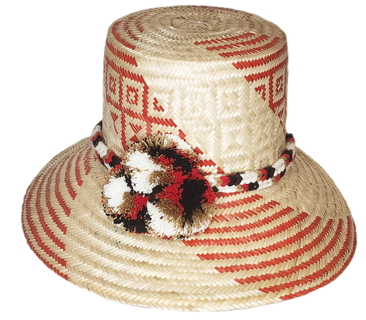 "Colorful handmade Wayuu hat crafted from Iraca palm, featuring decorative pompoms and adaptable fit, promoting Wayuu culture
