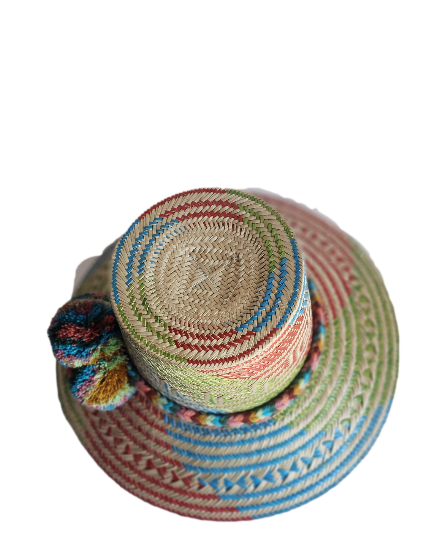 "Colorful handmade Wayuu hat crafted from Iraca palm, featuring adjustable size and cultural pompoms, supporting Wayuu artisa