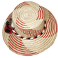 "Colorful handmade Wayuu hat crafted from Iraca palm, featuring decorative pompoms and adaptable fit, promoting Wayuu culture