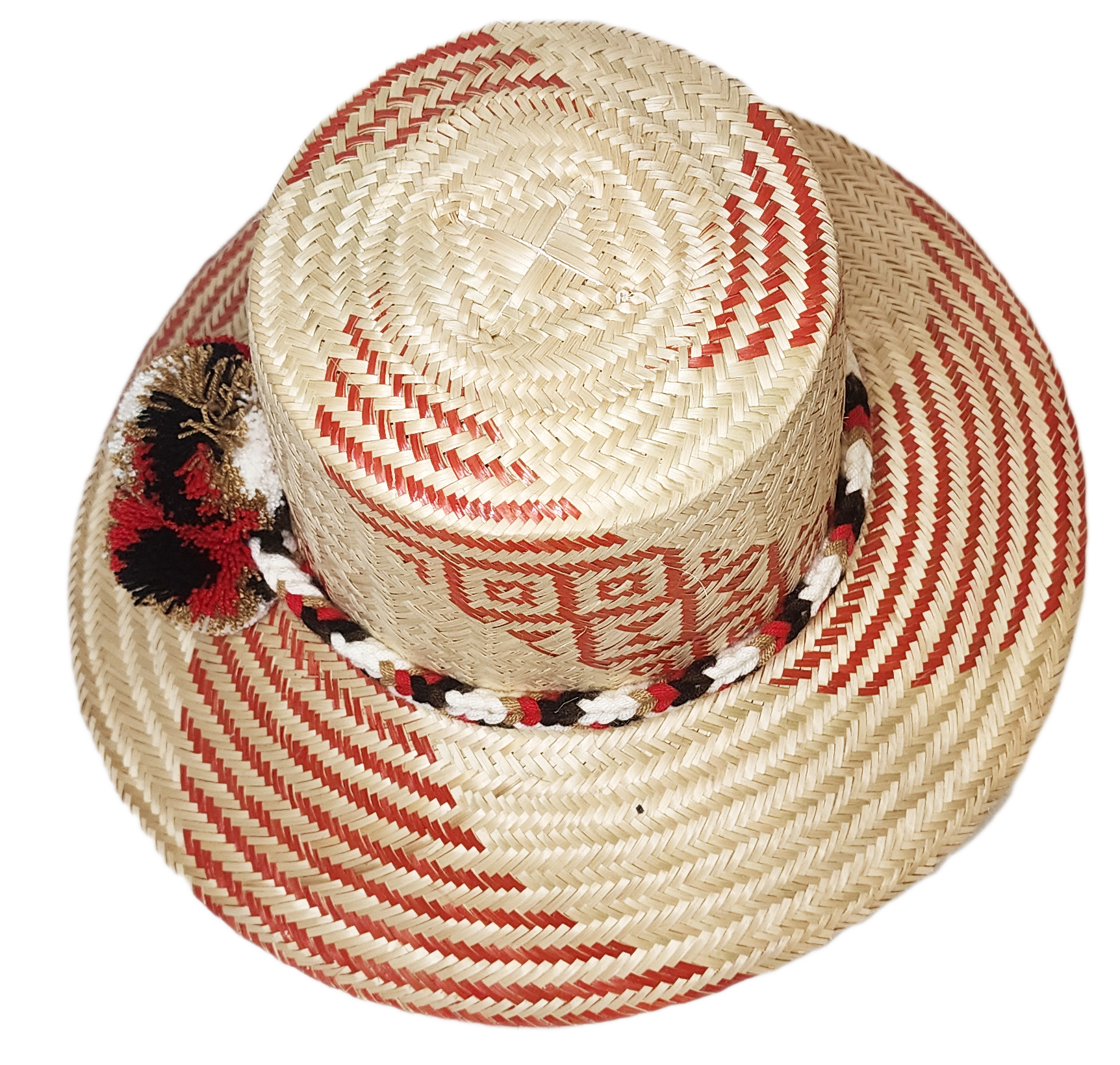 "Colorful handmade Wayuu hat crafted from Iraca palm, featuring decorative pompoms and adaptable fit, promoting Wayuu culture
