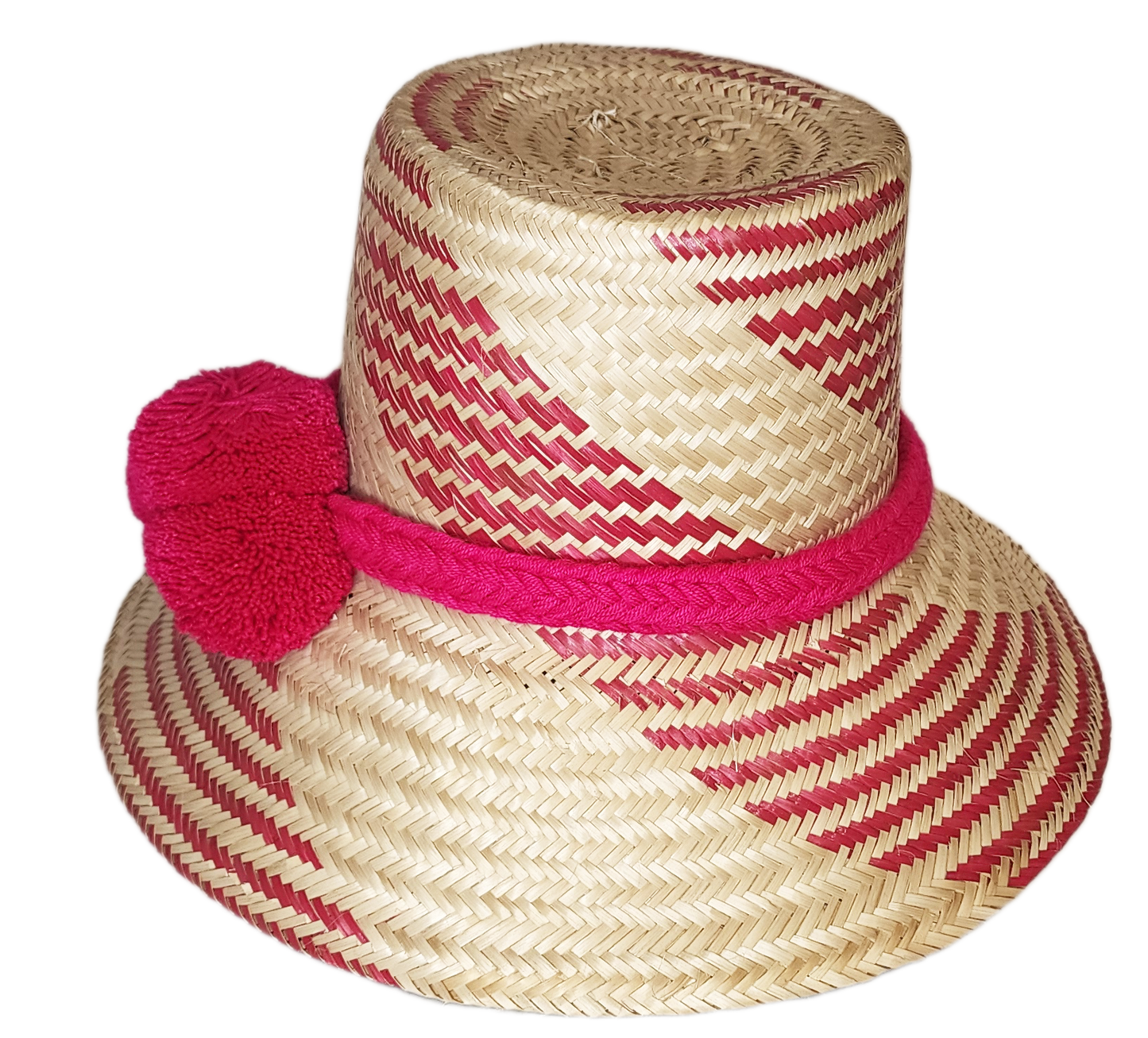 "Colorful handmade Wayuu hat crafted from Iraca palm fiber, adorned with significant pompoms, from Colombia and Venezuela."