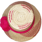 "Colorful handmade Wayuu hat crafted from Iraca palm fiber, adorned with significant pompoms, from Colombia and Venezuela."