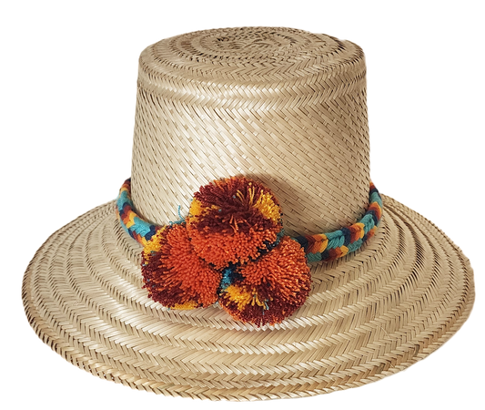 "Colorful handmade Wayuu hat crafted from Iraca palm fibers, adorned with culturally significant pompoms for style and prospe