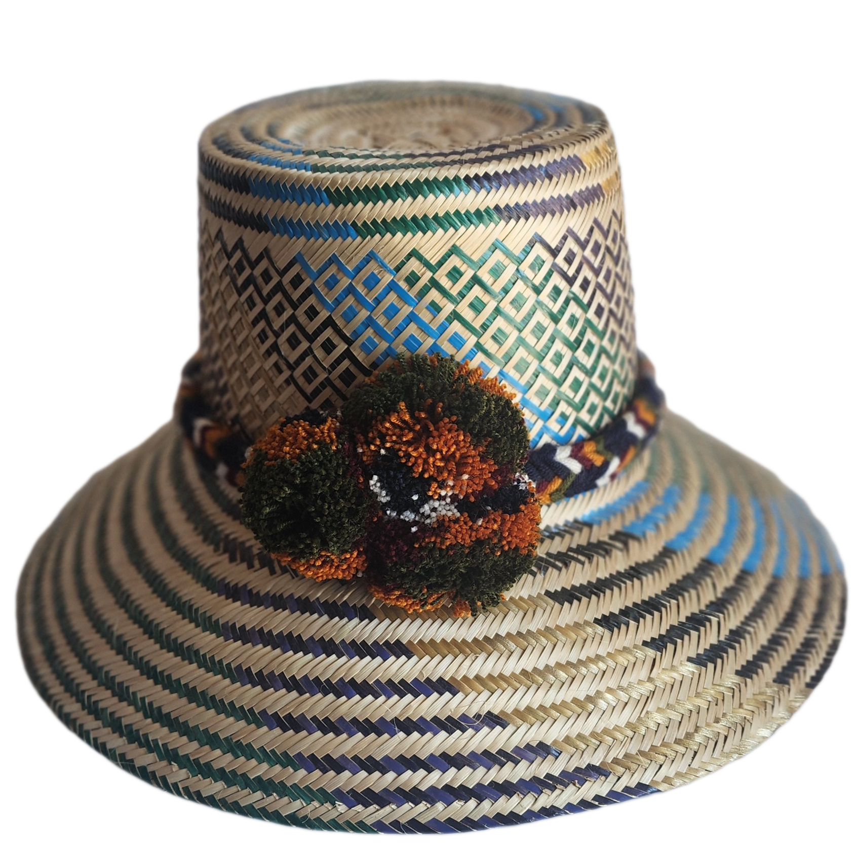 "Colorful handmade Wayuu hat crafted from Iraca palm fibers, adorned with culturally significant pompoms, offering adjustable