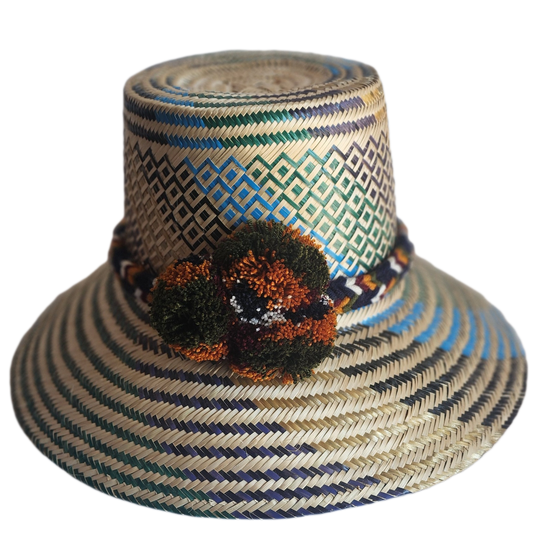 "Colorful handmade Wayuu hat crafted from Iraca palm fibers, adorned with culturally significant pompoms, offering adjustable