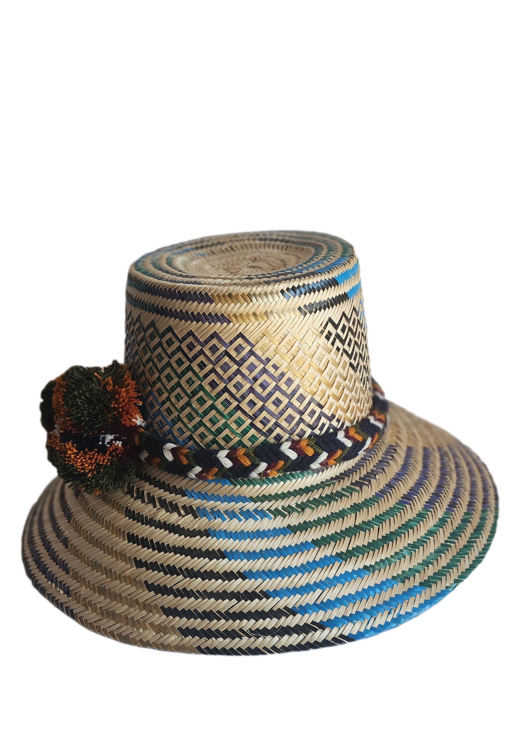 "Colorful handmade Wayuu hat crafted from Iraca palm fibers, adorned with culturally significant pompoms, offering adjustable