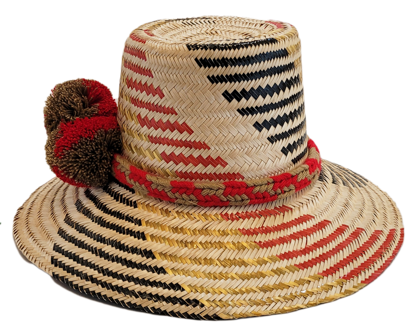 "Colorful handmade Wayuu hat crafted from Iraca palm fibers, adorned with significant cultural pom-poms for style and sun pro