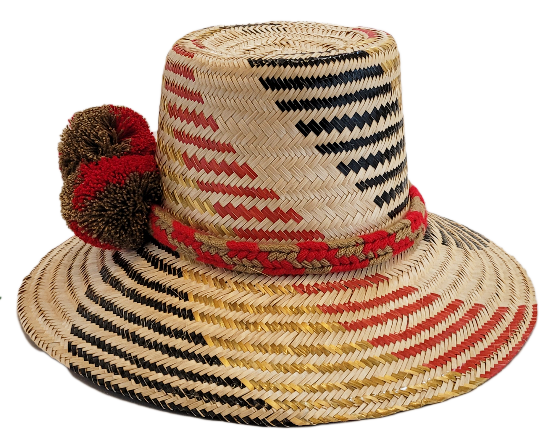 "Colorful handmade Wayuu hat crafted from Iraca palm fibers, adorned with significant cultural pom-poms for style and sun pro