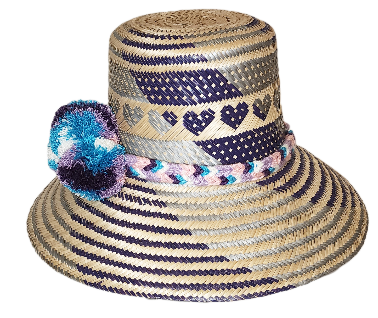 "Colorful handmade Wayuu hat crafted from Iraca palm fibers, adorned with meaningful pompoms, offering unique style and sun p