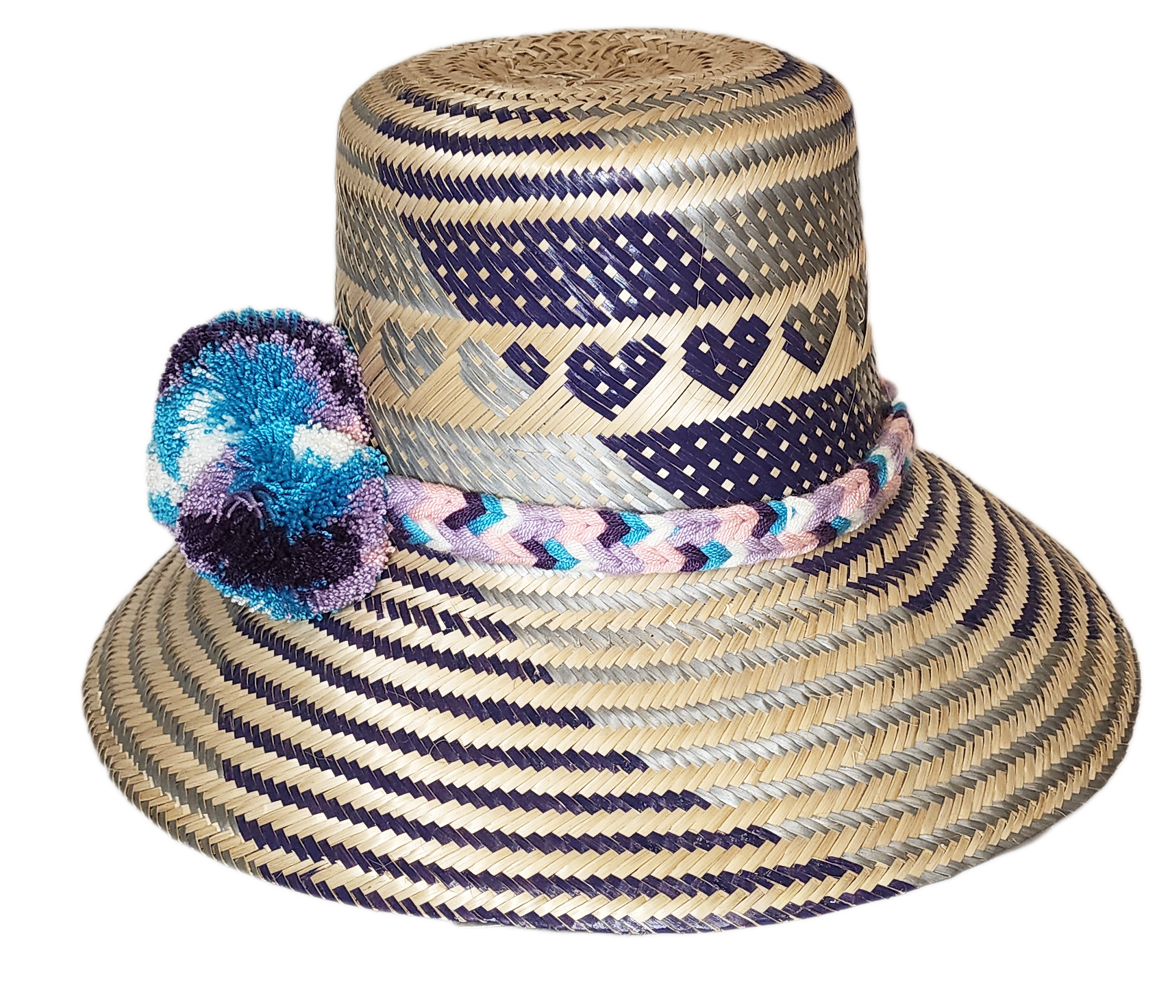 "Colorful handmade Wayuu hat crafted from Iraca palm fibers, adorned with meaningful pompoms, offering unique style and sun p
