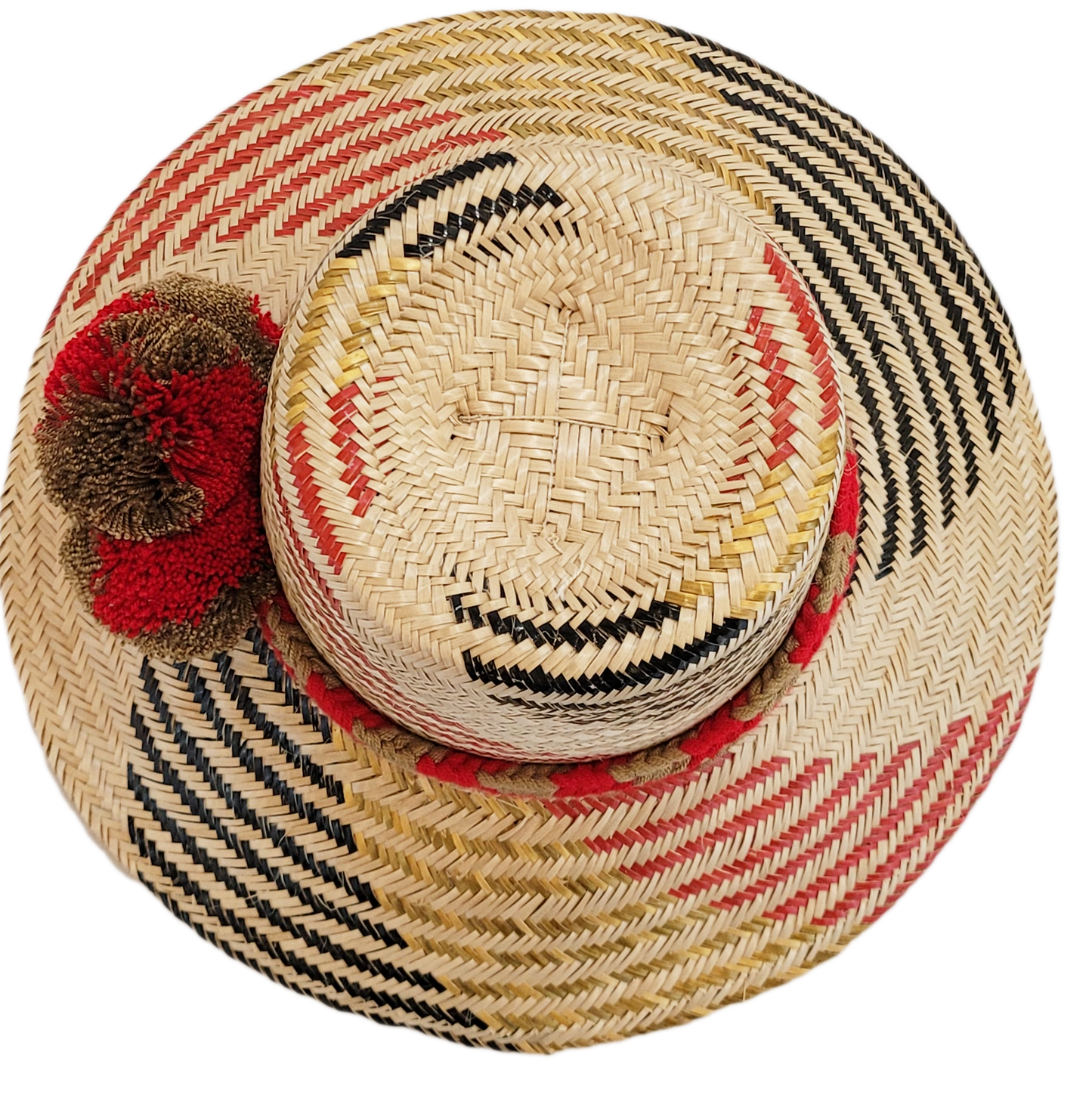 "Colorful handmade Wayuu hat crafted from Iraca palm fibers, adorned with significant cultural pom-poms for style and sun pro