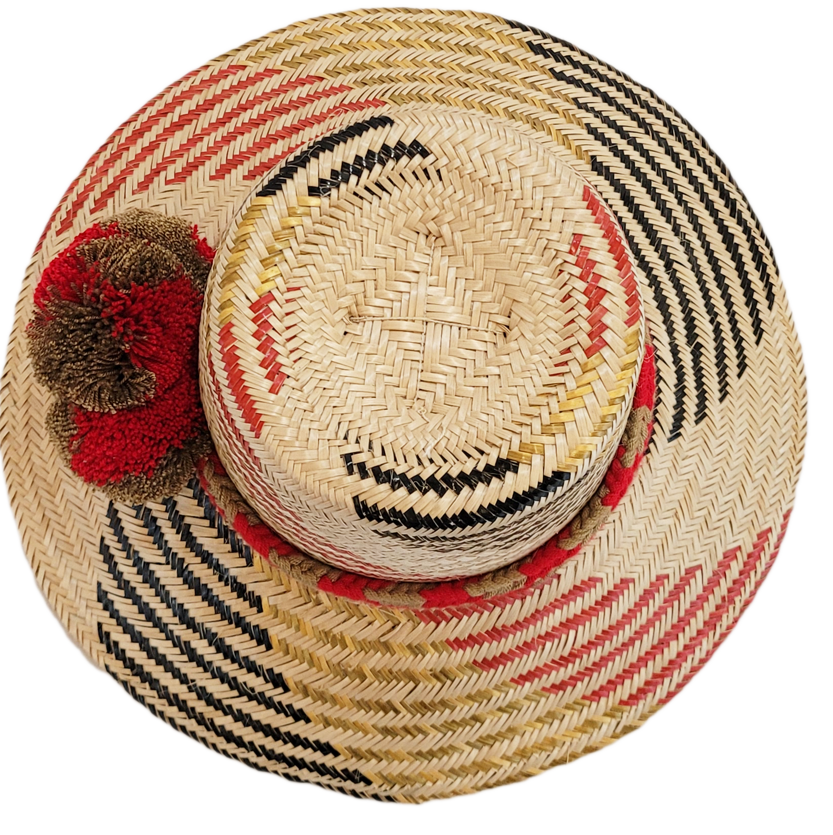 "Colorful handmade Wayuu hat crafted from Iraca palm fibers, adorned with significant cultural pom-poms for style and sun pro