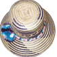 "Colorful handmade Wayuu hat crafted from Iraca palm fibers, adorned with meaningful pompoms, offering unique style and sun p