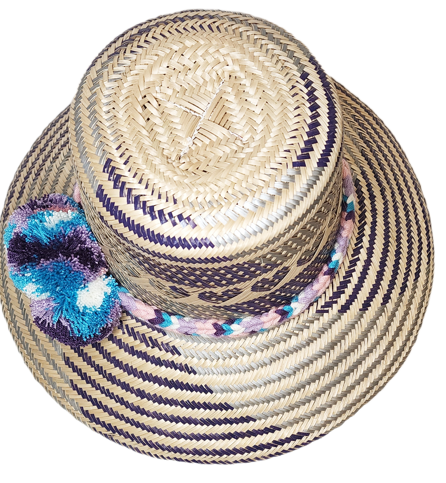 "Colorful handmade Wayuu hat crafted from Iraca palm fibers, adorned with meaningful pompoms, offering unique style and sun p