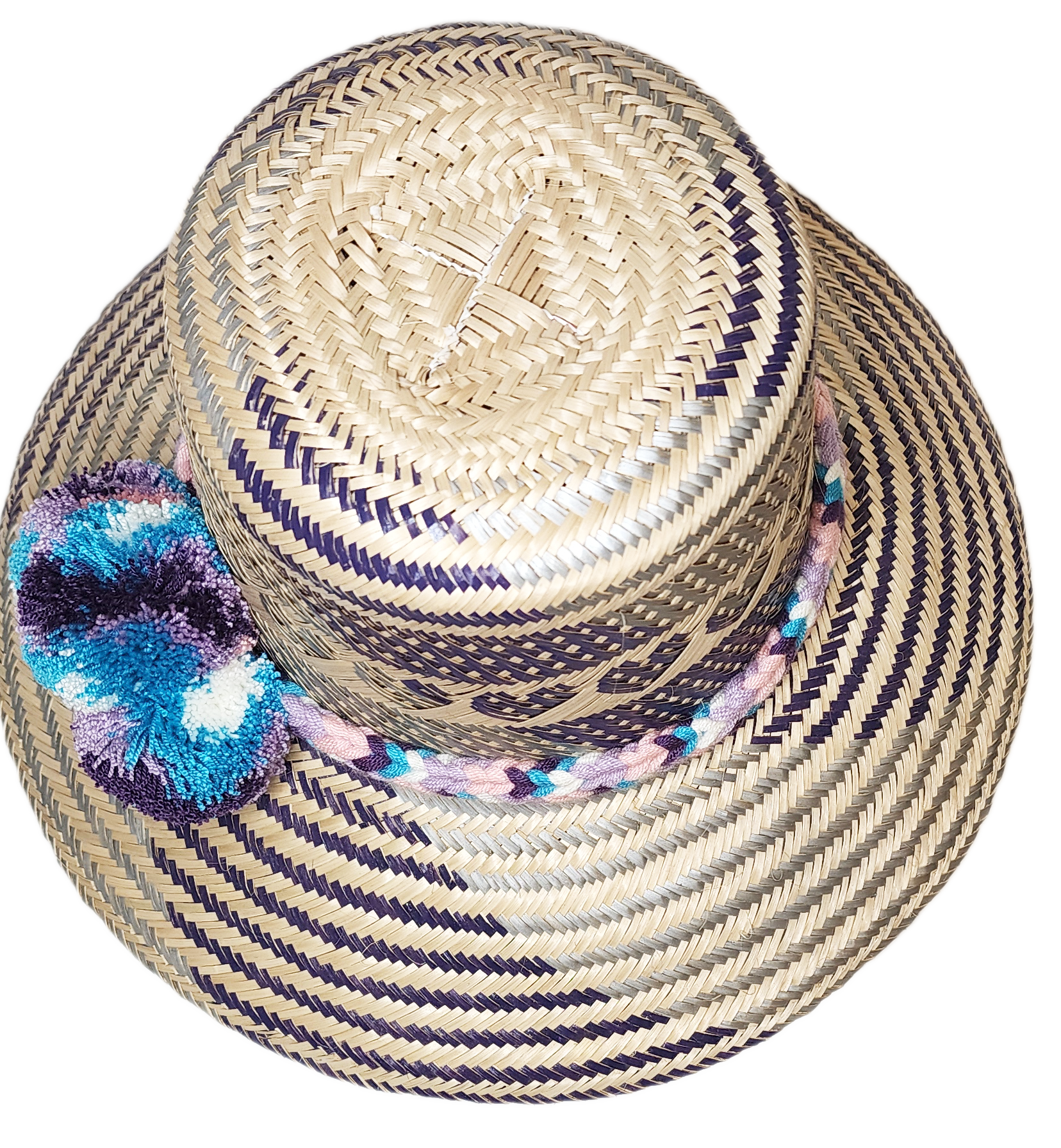 "Colorful handmade Wayuu hat crafted from Iraca palm fibers, adorned with meaningful pompoms, offering unique style and sun p