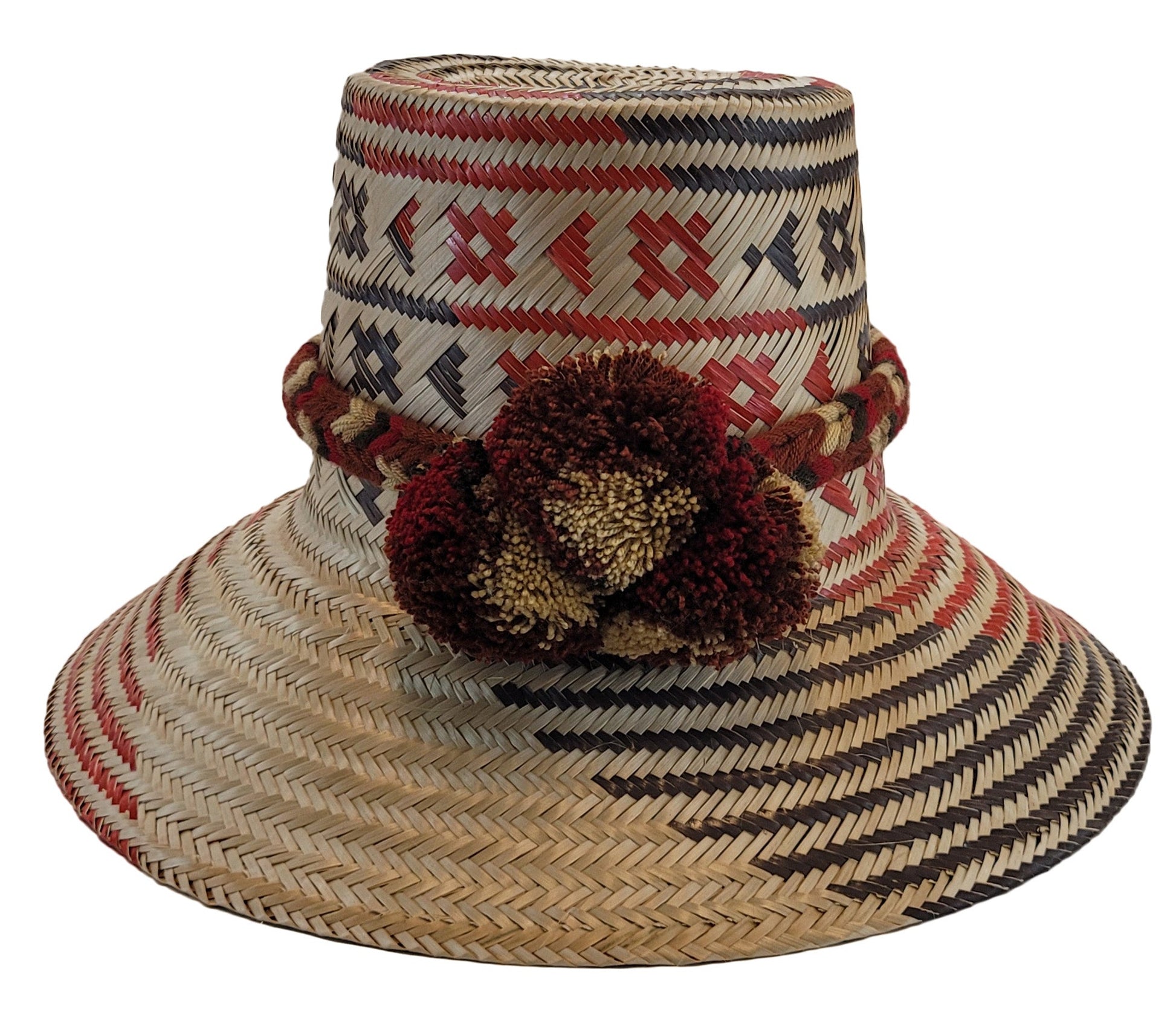 "Colorful handmade Wayuu hat crafted from iraca palm fibers, featuring a broad brim for sun protection and adjustable fit for