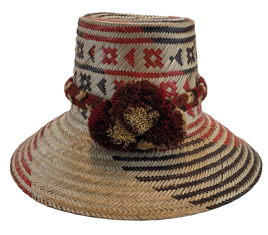 "Colorful handmade Wayuu hat crafted from iraca palm fibers, featuring a broad brim for sun protection and adjustable fit for