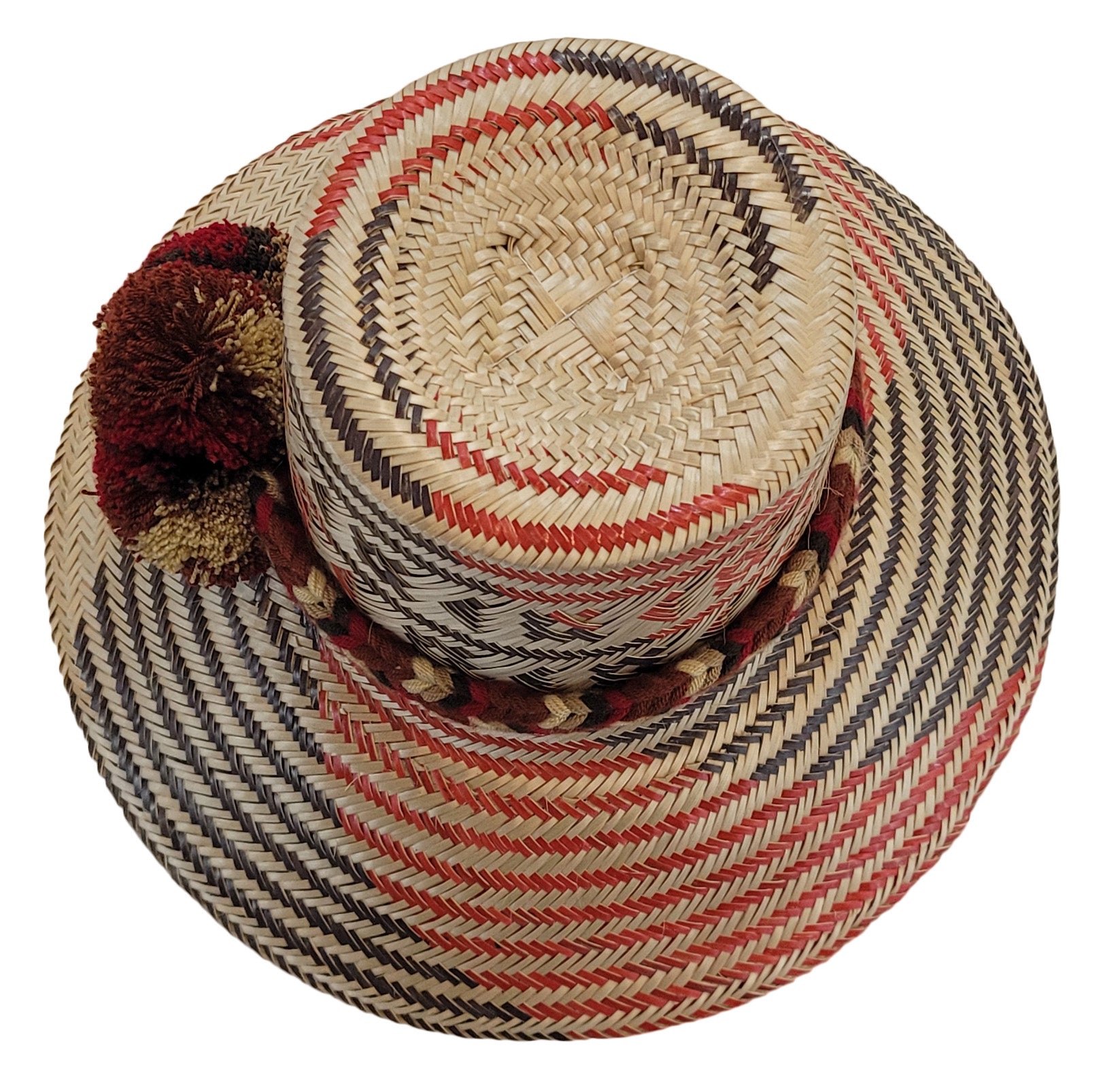 "Colorful handmade Wayuu hat crafted from iraca palm fibers, featuring a broad brim for sun protection and adjustable fit for
