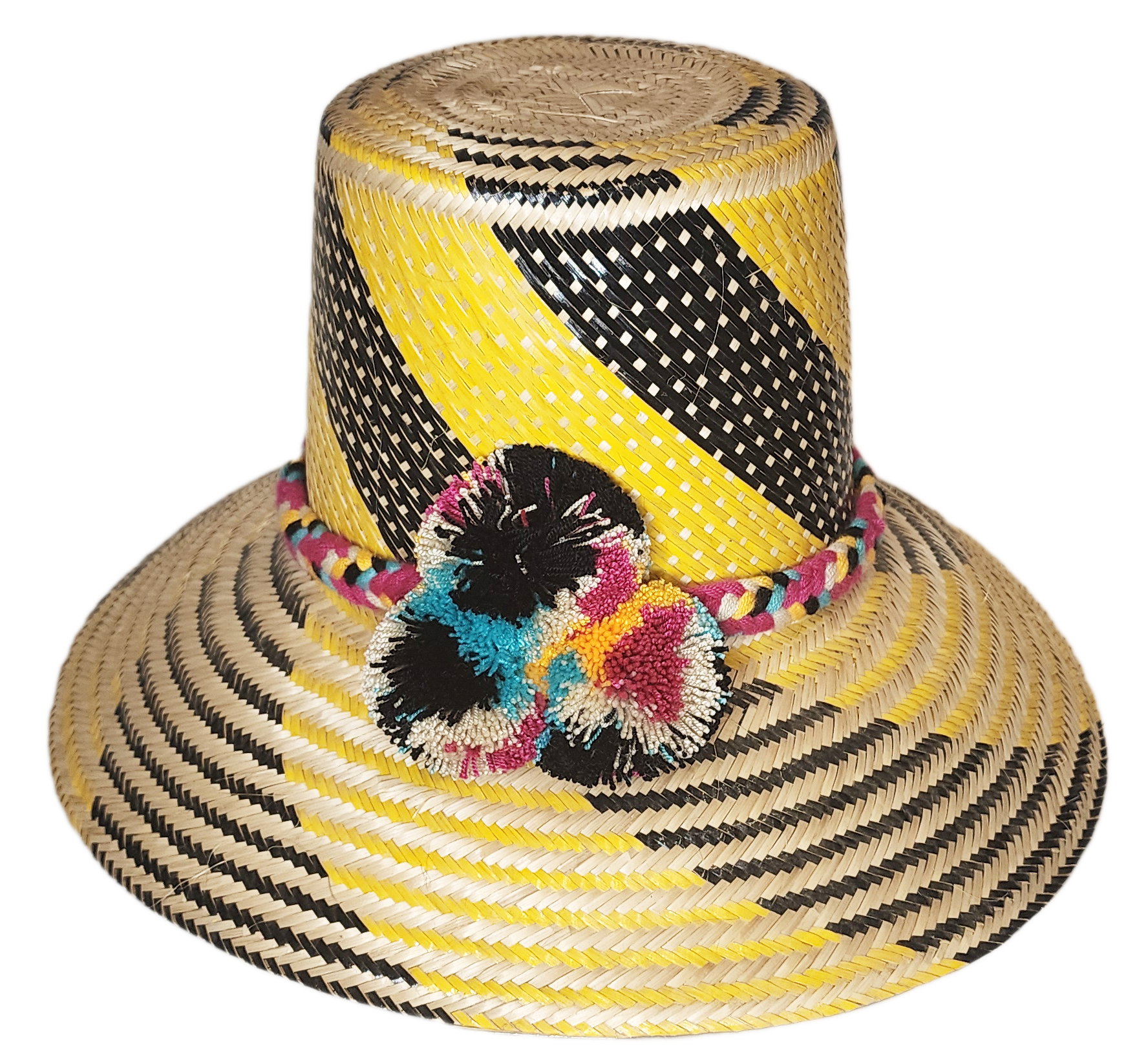 "Colorful handmade Wayuu hat crafted from Iraca palm fibers with decorative pompoms, showcasing vibrant Wayuu cultural design