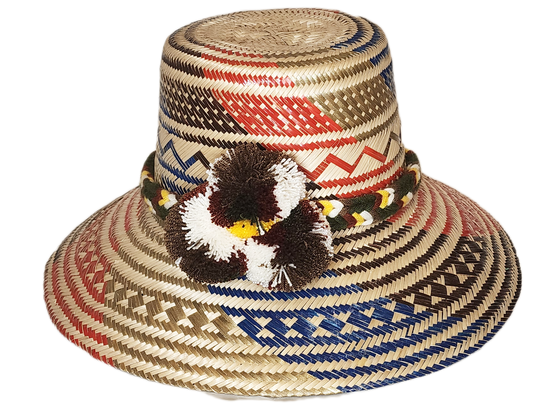 "Colorful handmade Wayuu hat, crafted from Iraca palm fibers with adjustable fit and decorative pompoms, symbolizing cultural