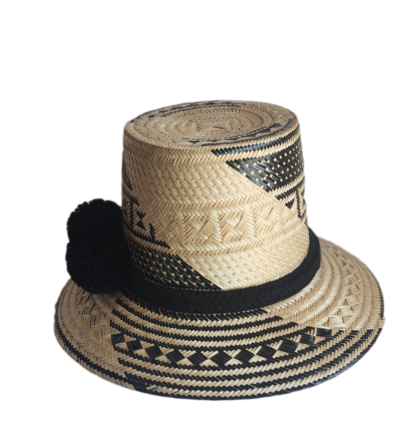 "Colorful handmade Wayuu hat crafted from Iraca palm fibers with culturally significant pompoms, offering sun protection and 
